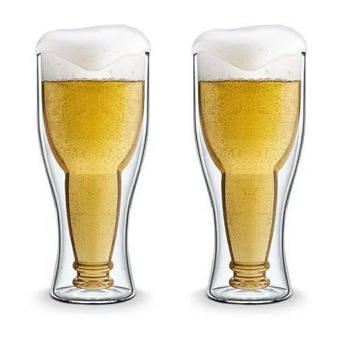 Two bottle-shaped beer glasses filled with golden beer and frothy foam