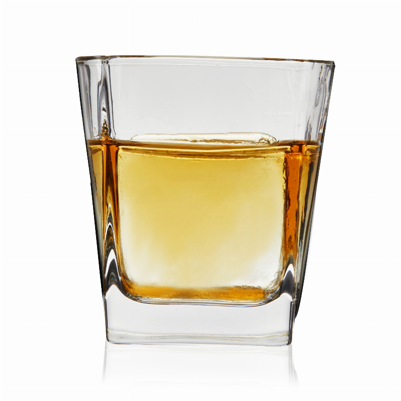 Square rocks cocktail glass with amber beverage, clear walls, thick square base