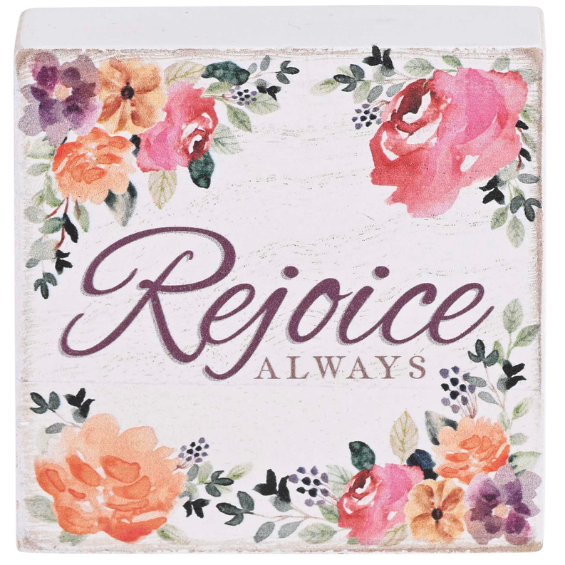 Tabletop plaque close-up with “Rejoice always” text and watercolor flowers