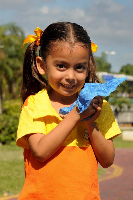 Blue towel held in hands for quick drying
