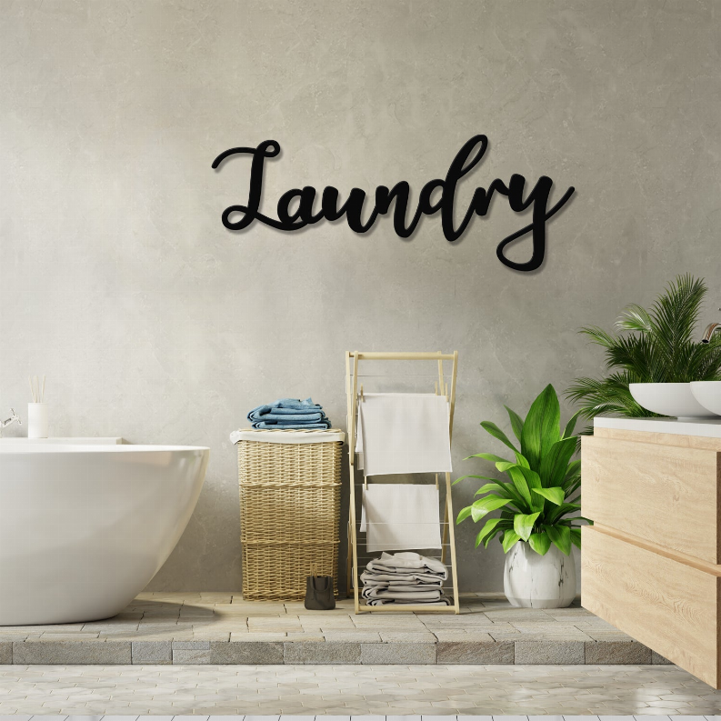 Black 'Laundry' metal wall art featuring cursive script lettering