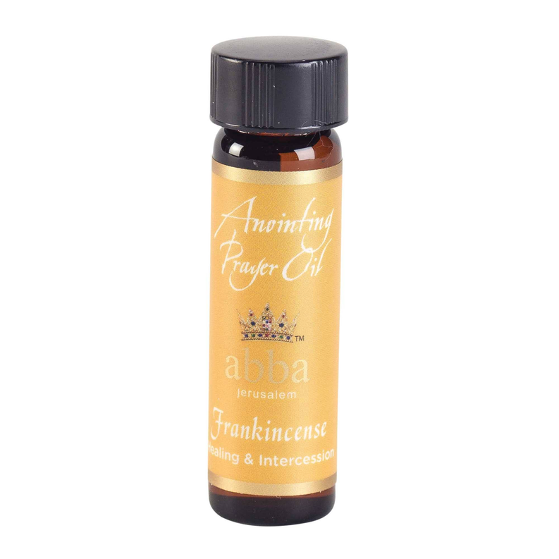 Frankincense anointing oil bottle, amber glass and black cap, close view of label