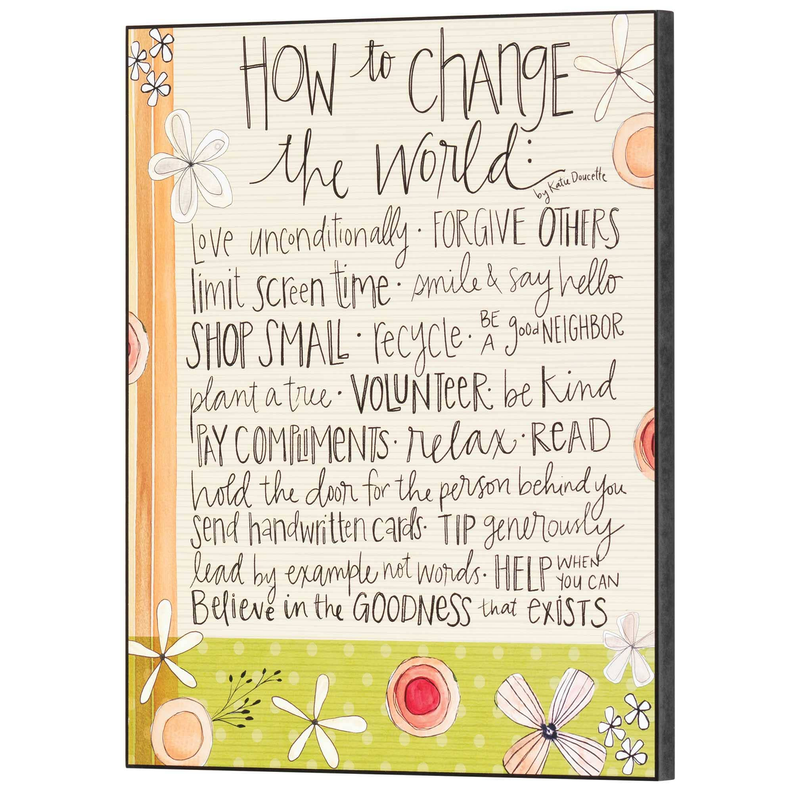 Wall plaque with colorful floral graphics and inspirational quote text on tan background.
