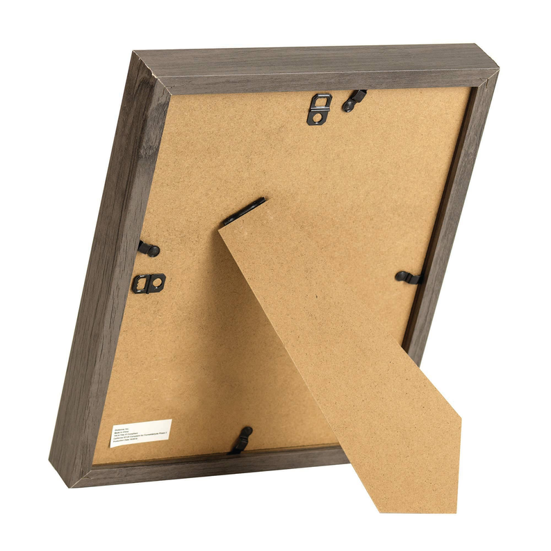 Back of wood framed wall art with hanging hardware and cardboard backing