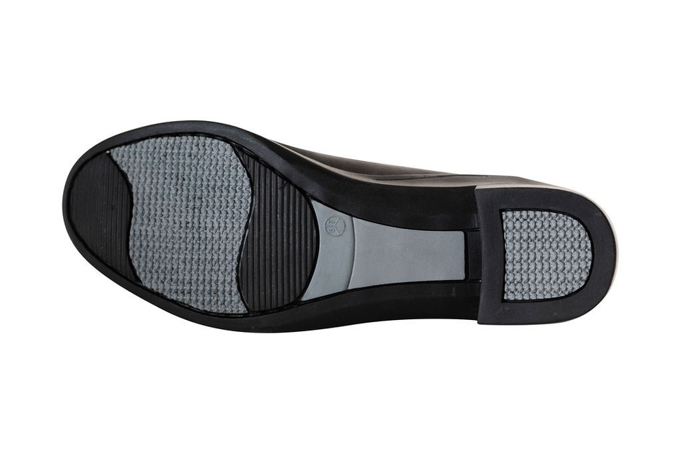 Black boot outsole with textured tread and grippy rubber heel section