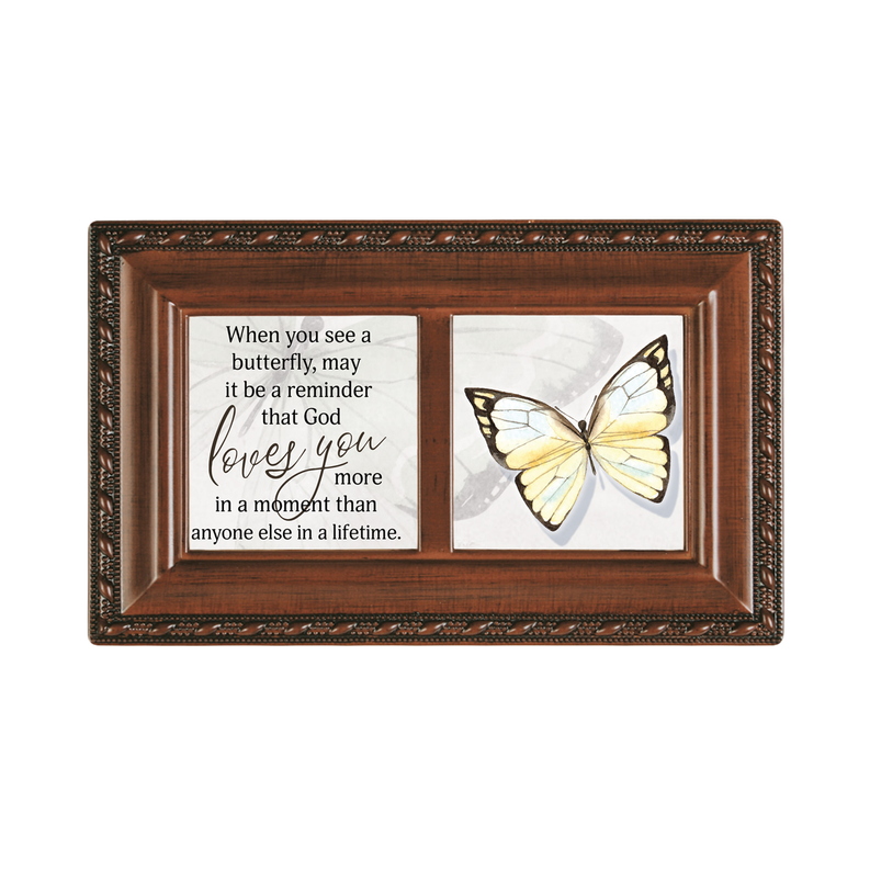 Wooden music box front with butterfly art, framed by dark decorative border