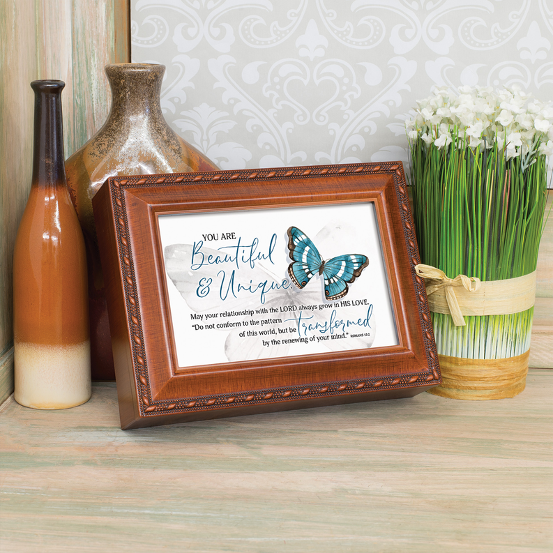 Wood music box angled front view, glass panel with teal butterfly and “Beautiful & Unique”