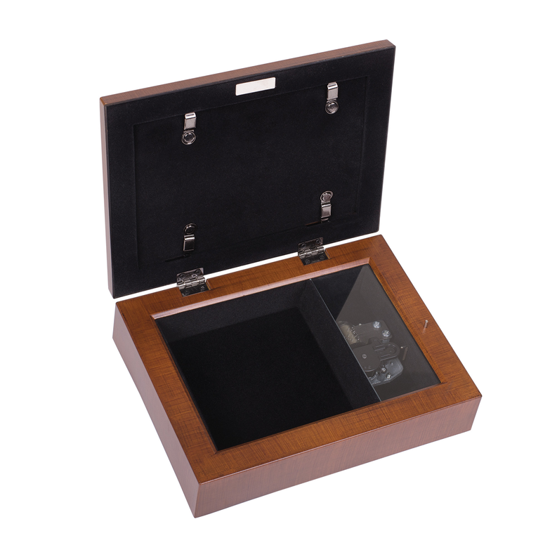Open wood music box with black-lined interior and hinged lid