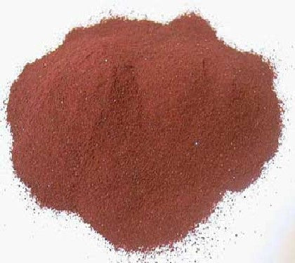 Loose reddish-brown granular supplement powder