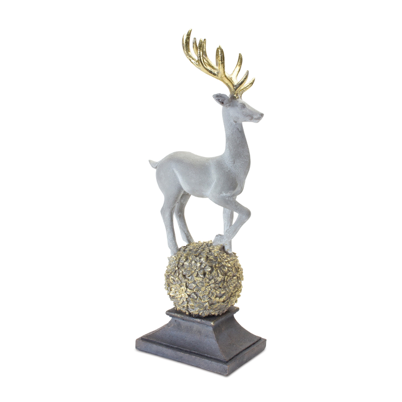 Gray deer figurine with gold antlers standing on textured orb base