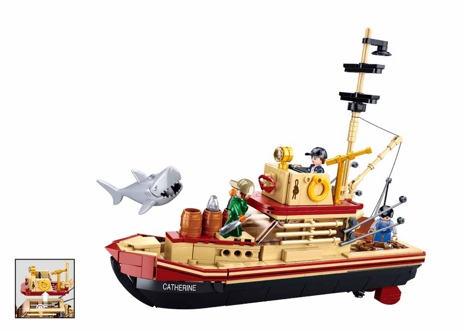 Brick ship model with shark figure, red and gold details, and mast rigging