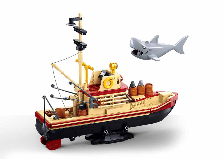 Brick whaling ship model with shark figure and tall mast, 3/4 view