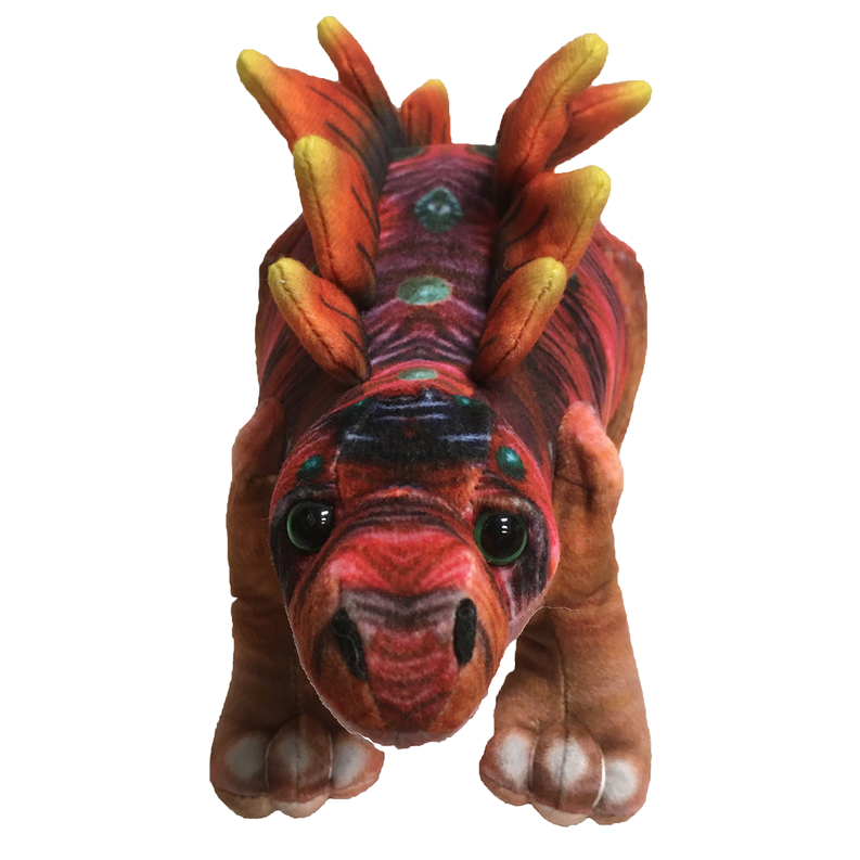 Front-facing stegosaurus plush with red muzzle, green eyes, raised dorsal spines