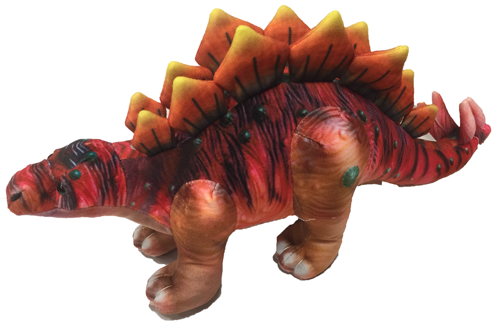 Crouching stegosaurus plush dinosaur with red patterned body, yellow-orange spikes, long tail