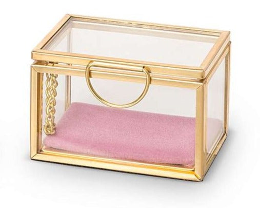 Glass jewelry box with gold frame, clear lid, round gold handle; holds pink velvet insert.
