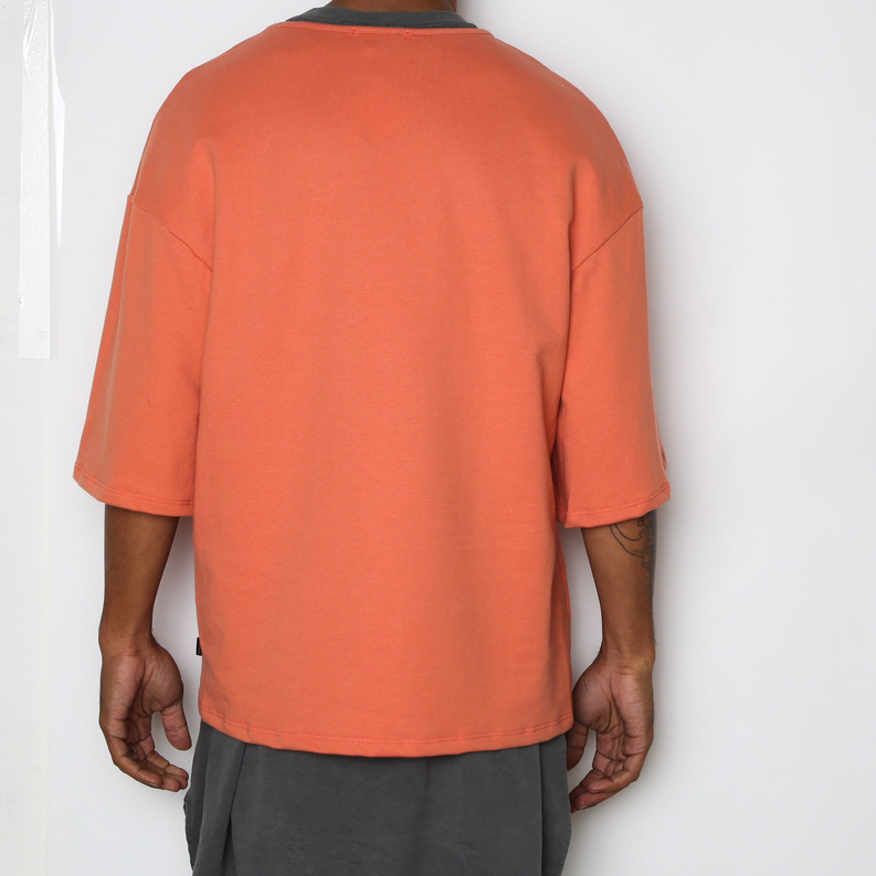 Peach-orange slouch T-shirt back view, crew neck, short sleeves, relaxed fit