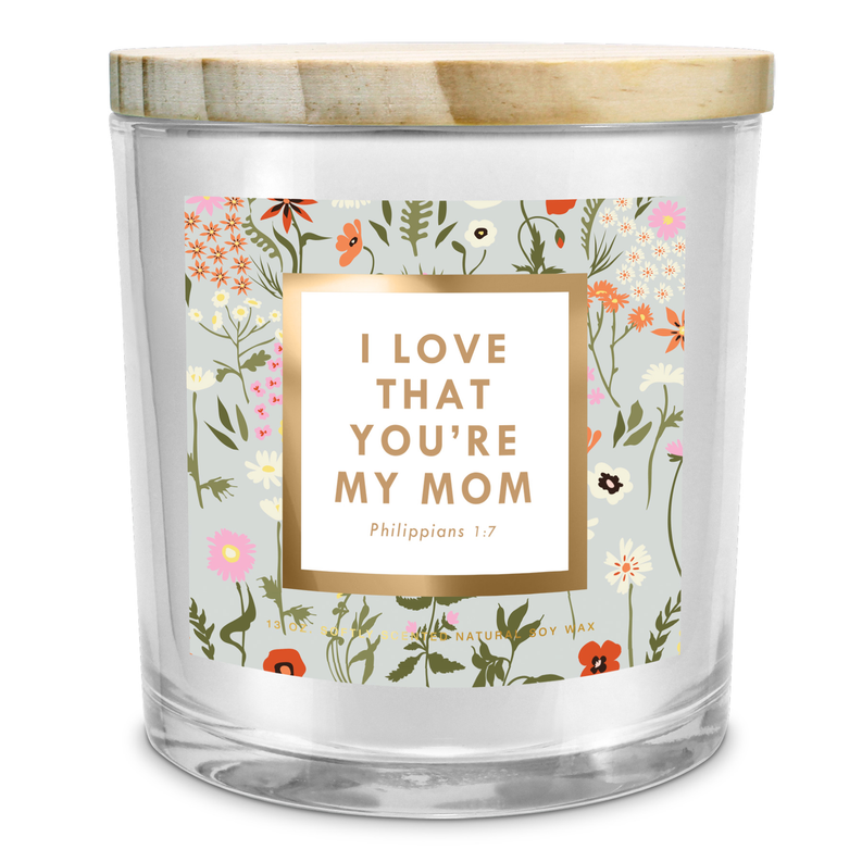 Soy candle jar with floral wrapper and “I love that you’re my mom” text label