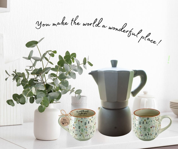 Vintage floral ceramic coffee mug with dark green interior and side handle