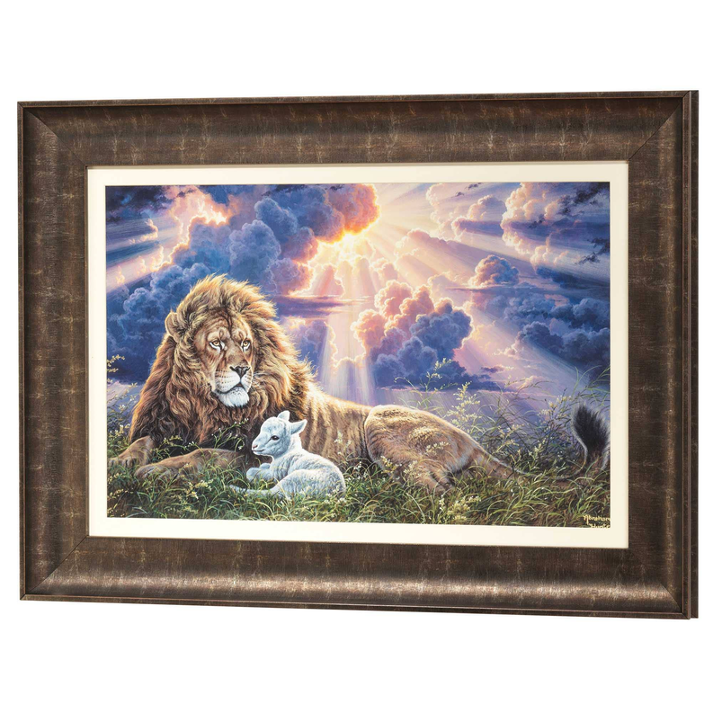 Framed lion and lamb wall art landscape with warm sky clouds; dark wood frame