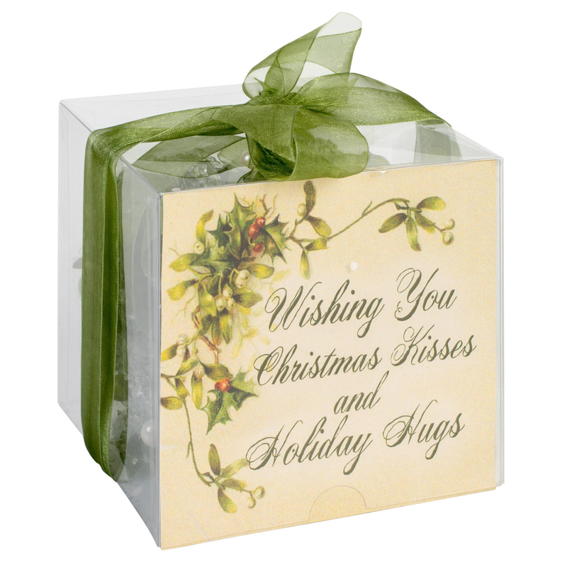 Holiday gift cube with printed wishes, green organza bow, and clear plastic wrap