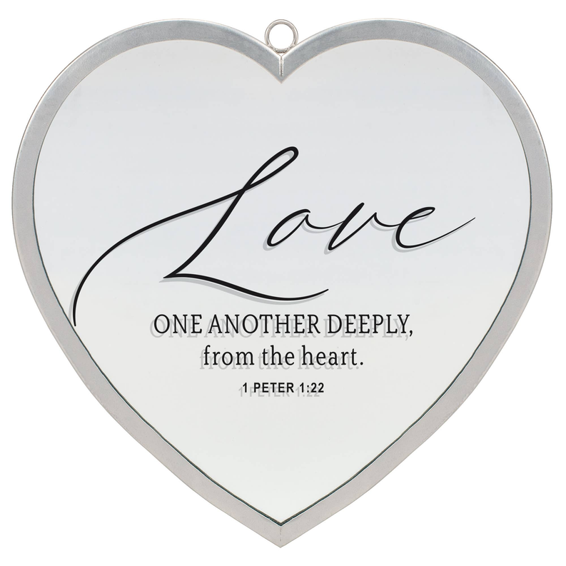 Heart-shaped wall mirror with silver frame and Love quote