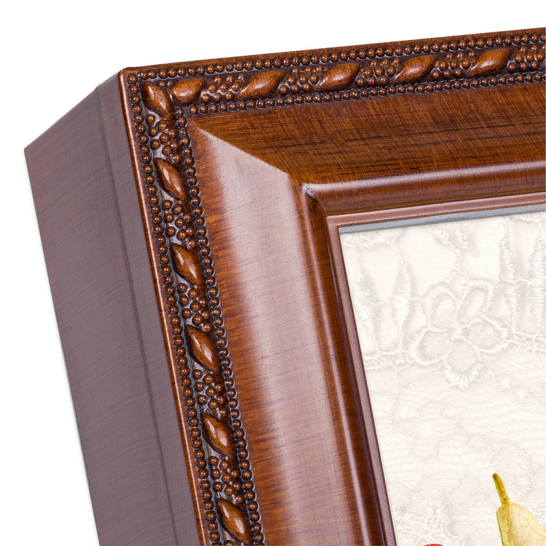 Wooden picture frame corner with dark beaded border and lace prayer panel