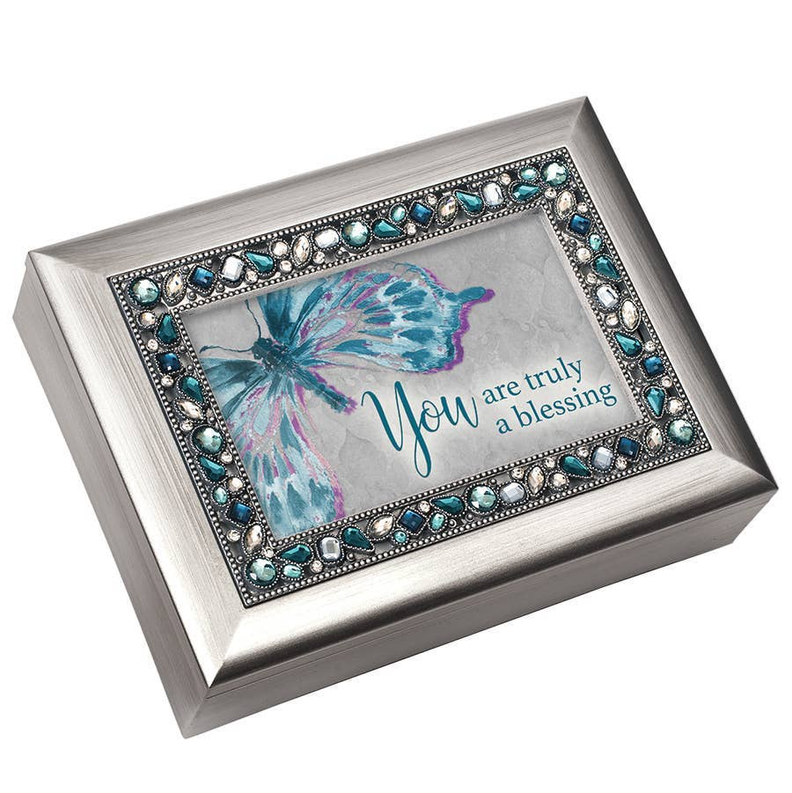 Silver jeweled music box with blue butterfly graphic and decorative gem-style border