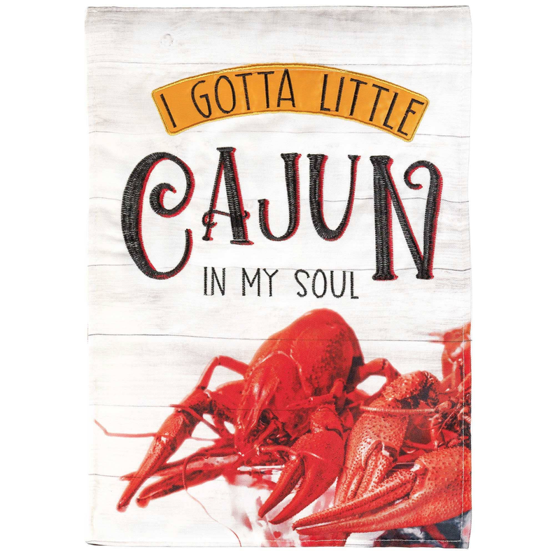 White fabric applique flag reading 'I gotta little Cajun in my soul' with red crawfish