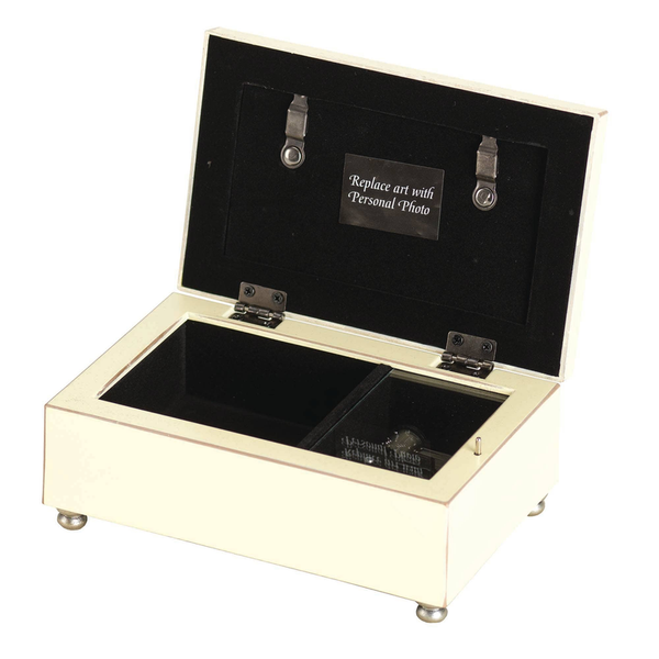 Ivory music box with open lid, black velvet interior, photo slot under hinge latches