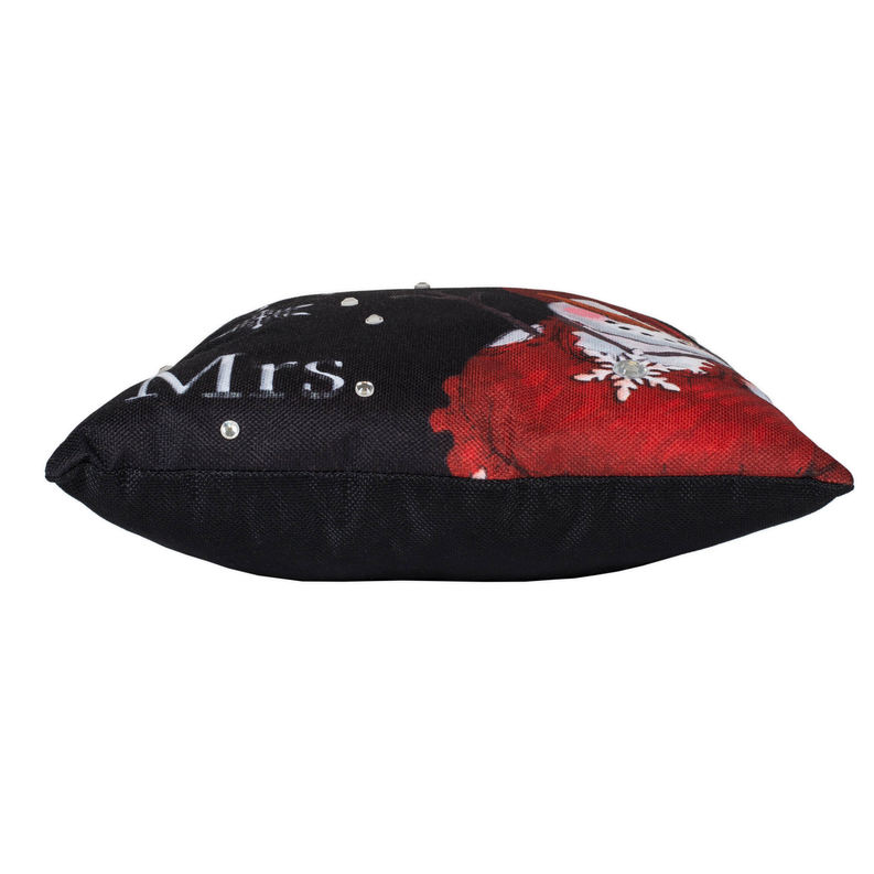 Black throw pillow with Mrs. and red snowman graphic, shown from the side