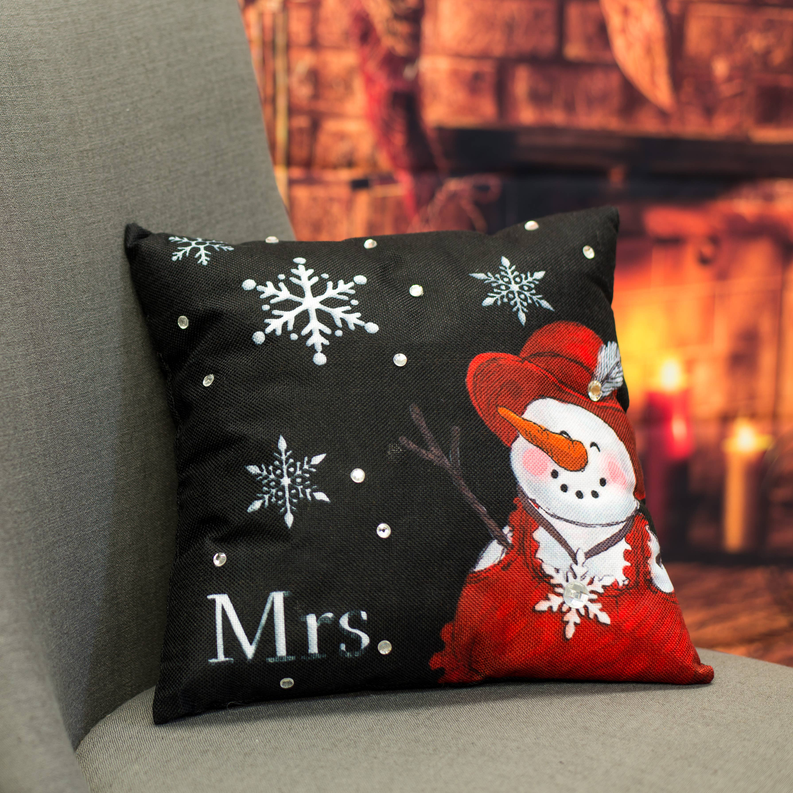 Black holiday throw pillow with Mrs. print, red snowman figure, white snowflakes