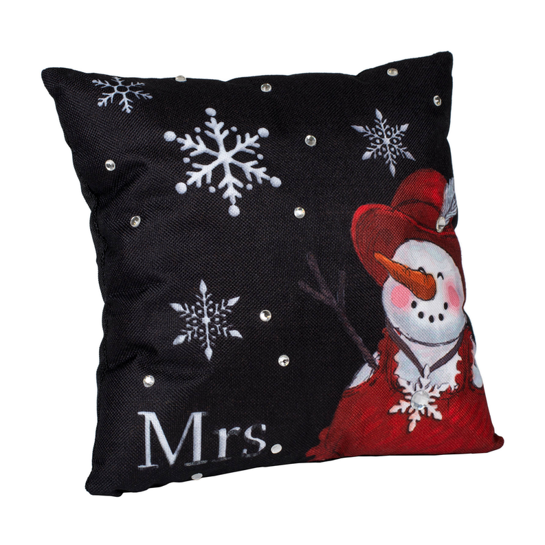 Black throw pillow with Mrs. text, red-clad snowman, and scattered white snowflakes