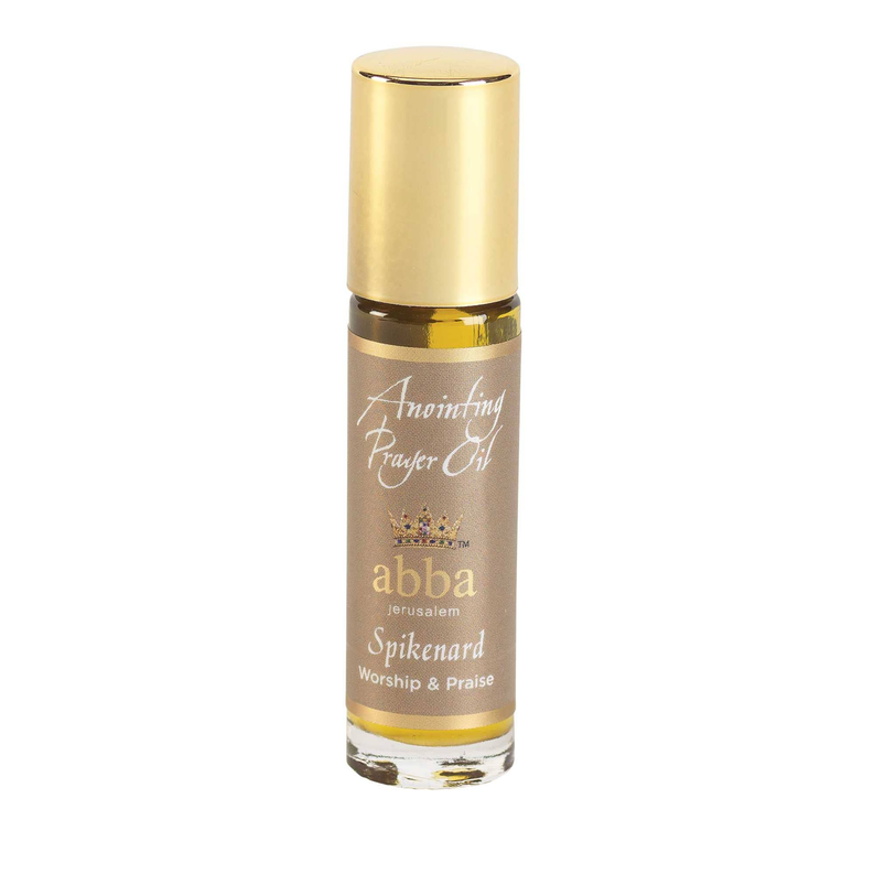 Gold capped roll-on anointing oil bottle with amber liquid and printed label