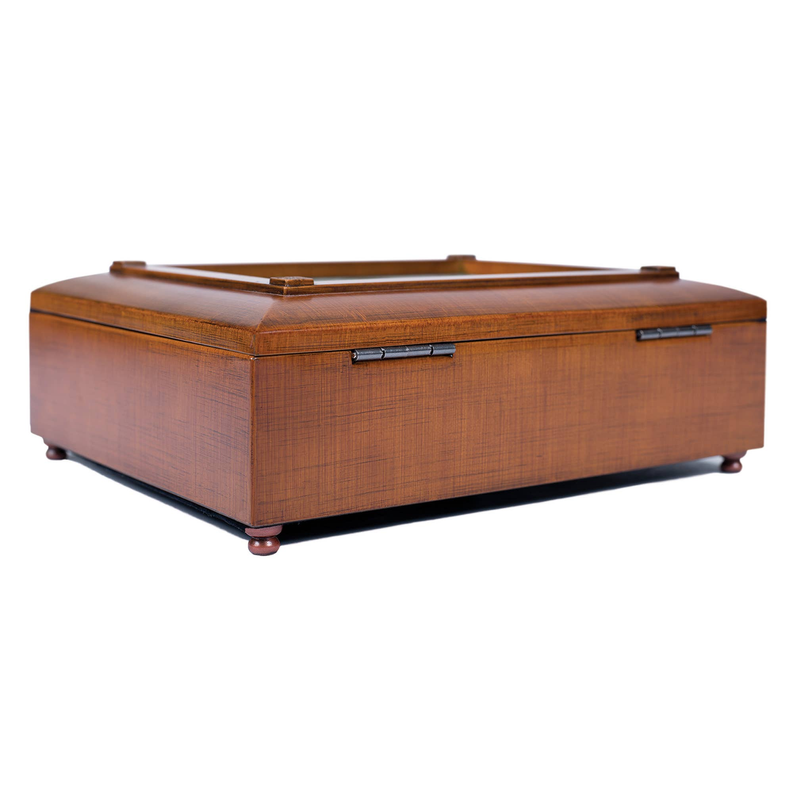 Wooden jewelry box with metal latch, hinged lid, and corner feet, closed view