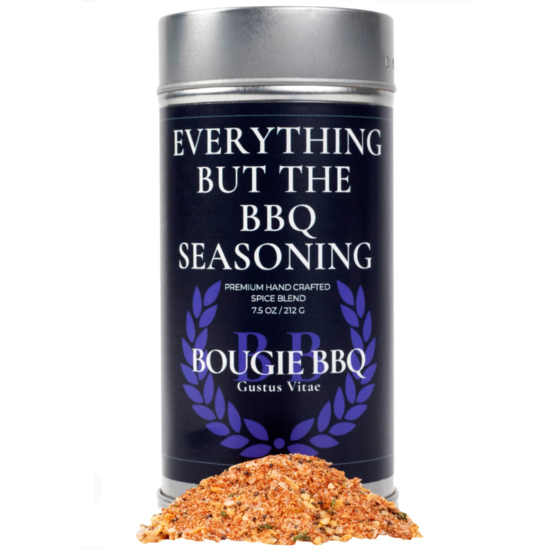 Everything But The BBQ seasoning can with orange spice rub pile