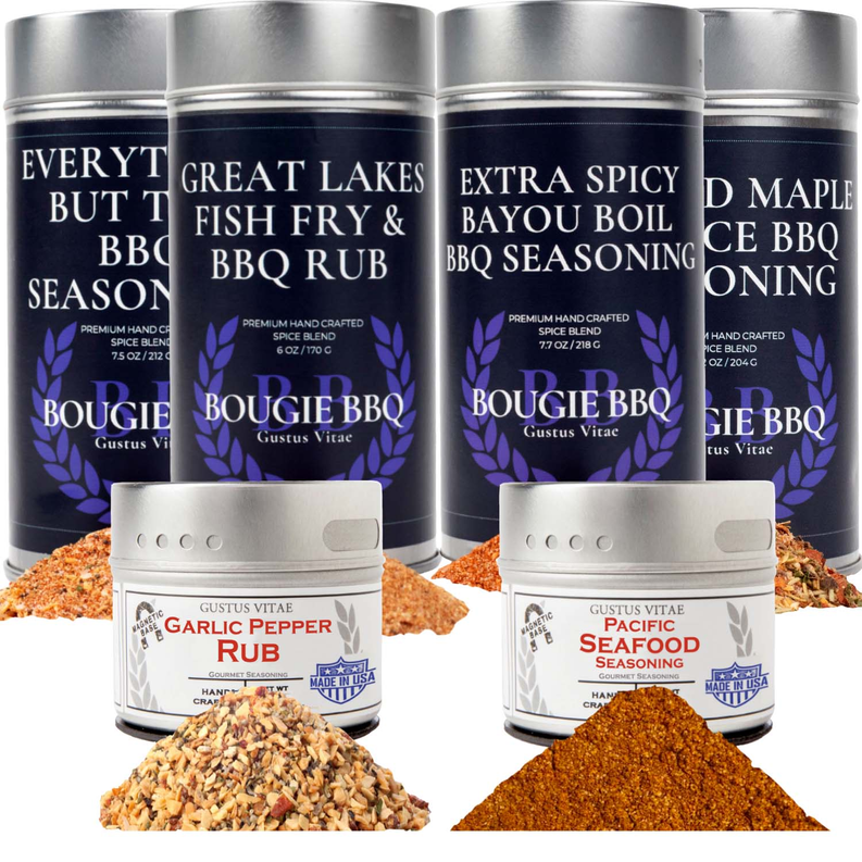 Six spice rub seasoning cans collection with mounded seasoning piles