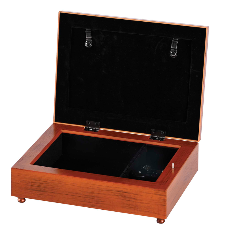 Open wooden music box with black velvet lining and hinged lid hardware