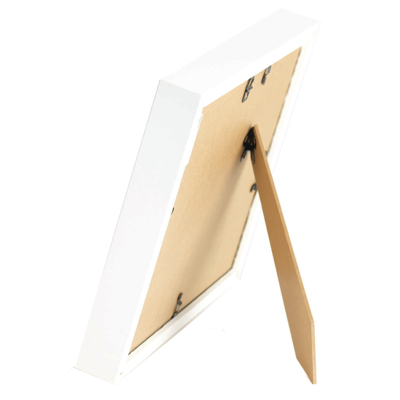 White framed wall art with angled view and light wood back