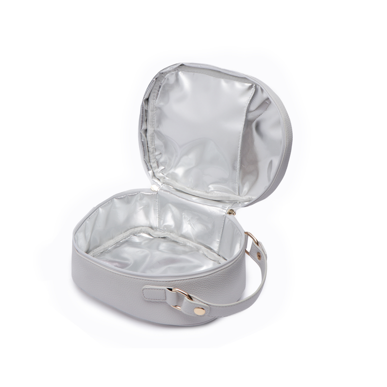 Snack bag with open top, shiny silver insulated lining, and front strap with gold hardware
