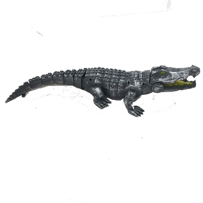 Mechanical walking crocodile toy, dark silver body with yellow jaw detail, textured scales.