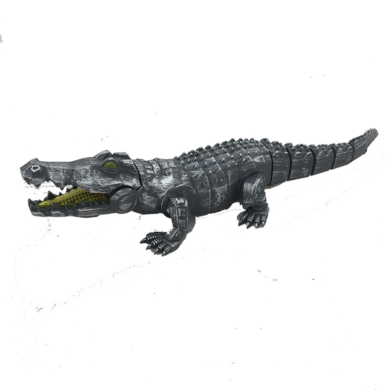 Mechanical walking crocodile toy, dark silver finish, yellow eyes and textured legs.