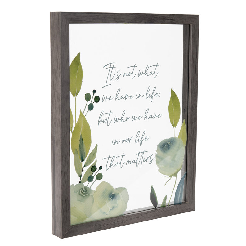 Wood-framed wall art with green floral illustration and handwritten text