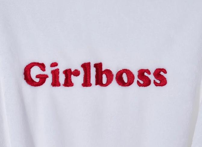 White plush fleece nap blanket with red 'Girlboss' embroidery