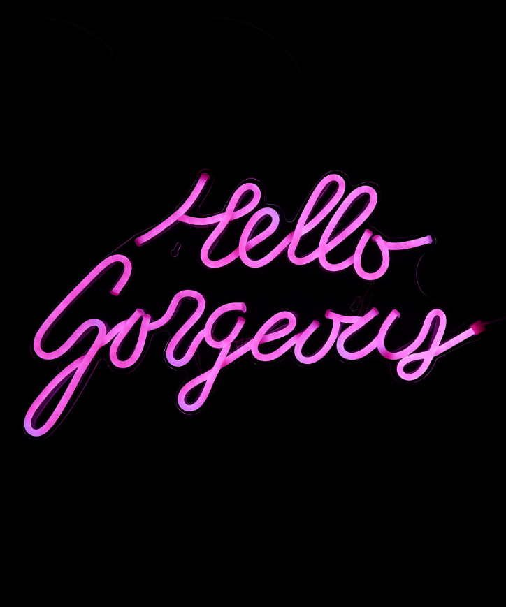 LED neon sign with glowing pink cursive 'Hello Gorgeous' lettering