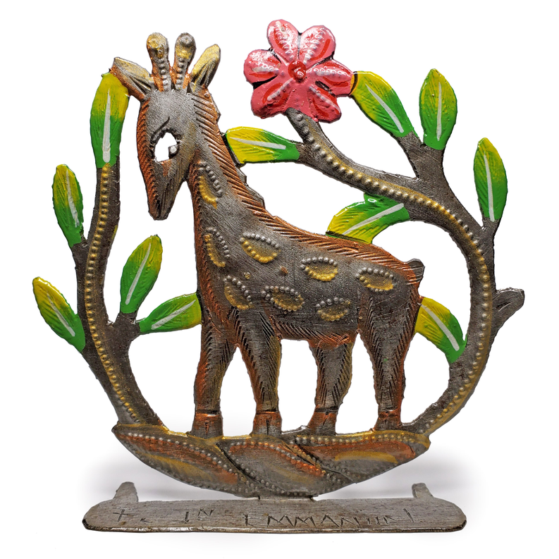 Freestanding painted giraffe metal sculpture with red flower and green leaves accents