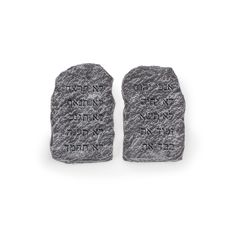 Two dark gray carved stone tablets with Hebrew-style engraved markings, set together