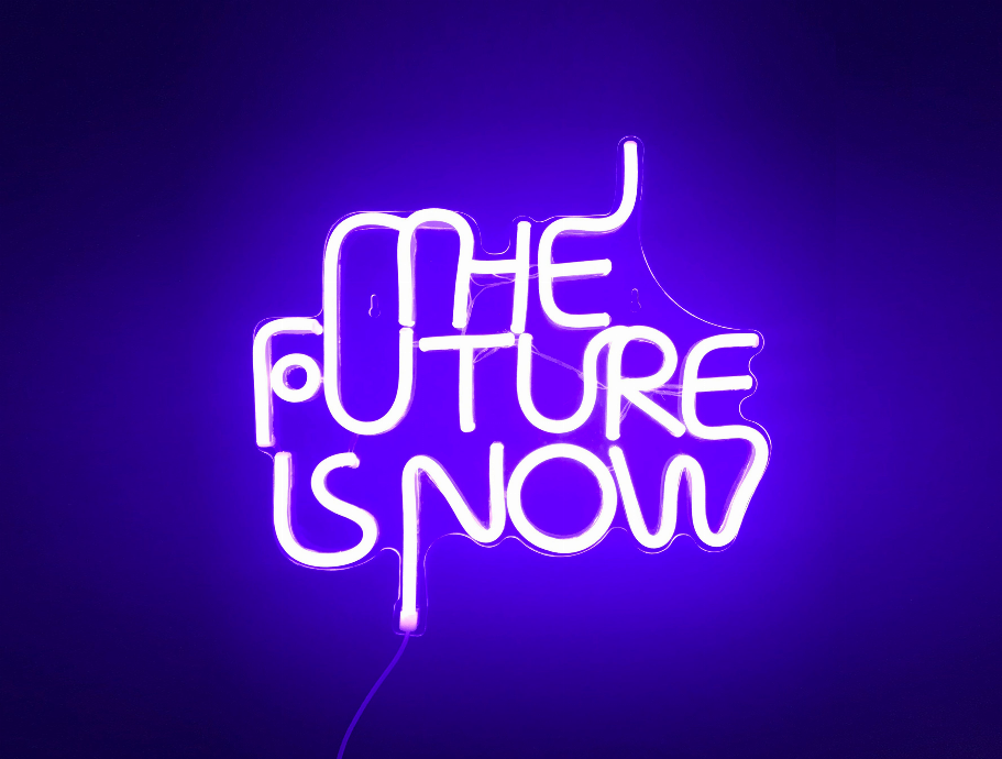 Glowing violet LED neon sign reading 'THE FUTURE IS NOW'