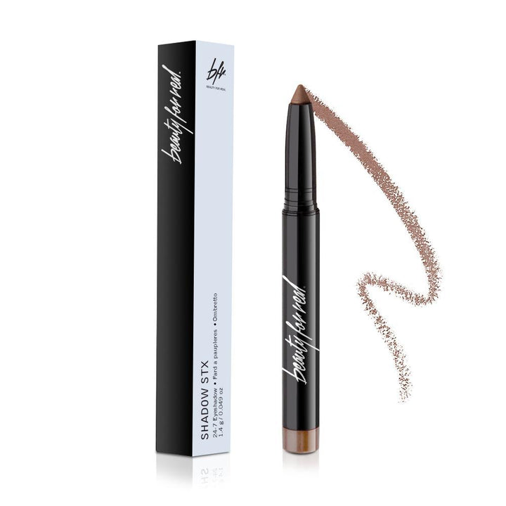 Eyeshadow stick and box with bronze-brown tip and swatch line