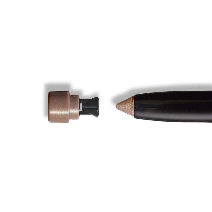Close-up of eyeshadow stick tip and retractable end in bronze-brown