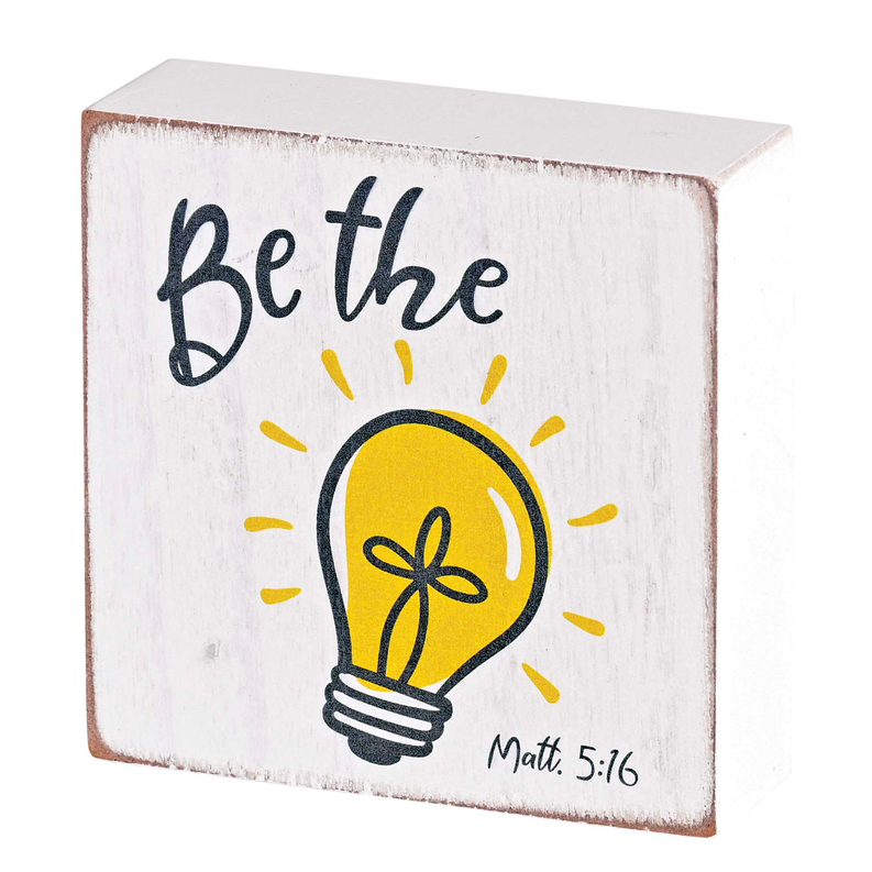 Tabletop plaque with 'Be the light', yellow lightbulb icon and 'Matt. 5:16'